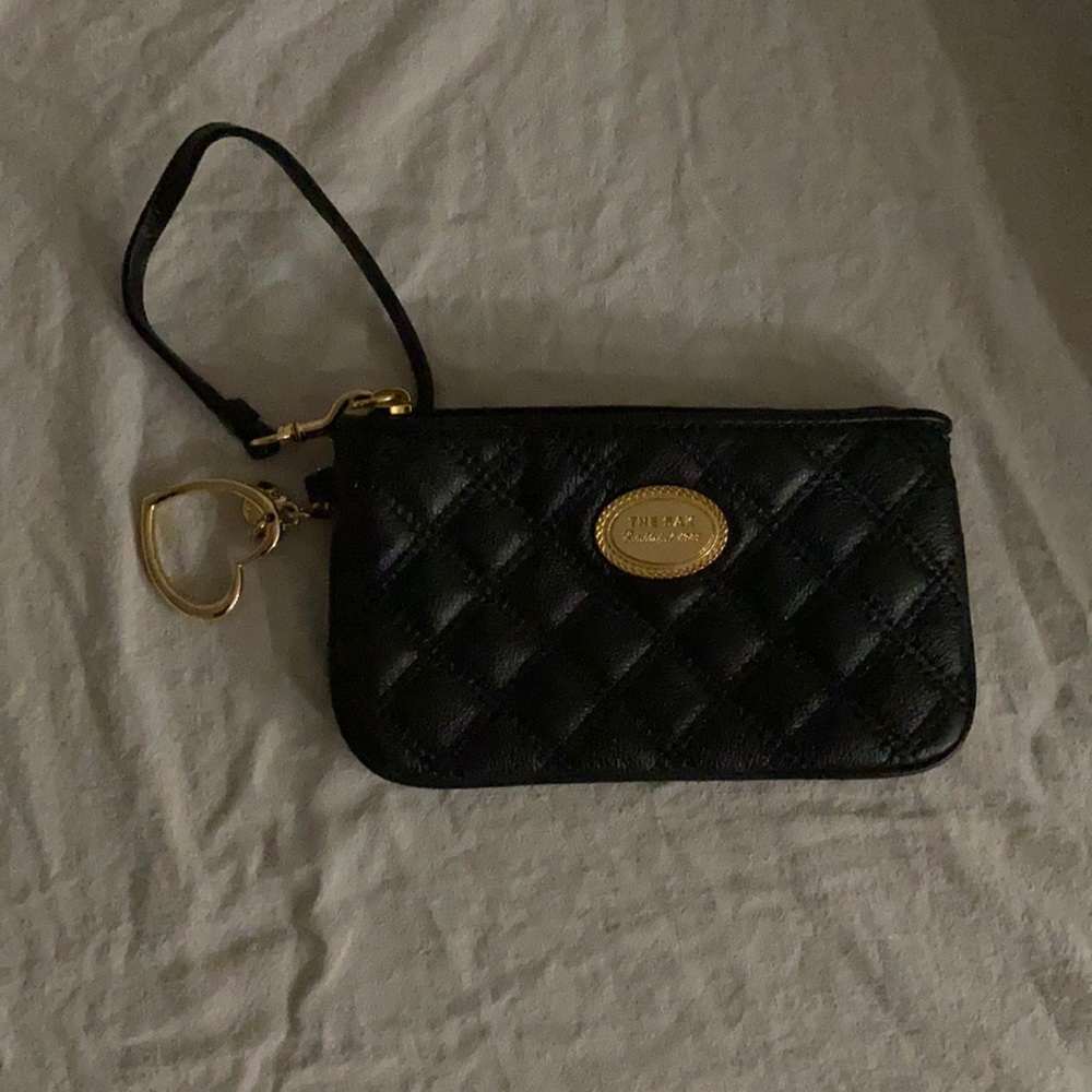 THE SAK  never used - black quilted leather wristlet 8” x 5”.gold hearts charms